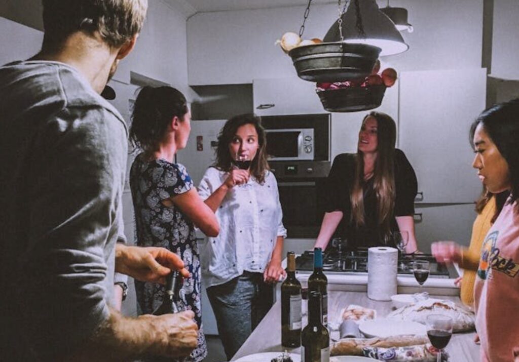 People around table talking and drinking